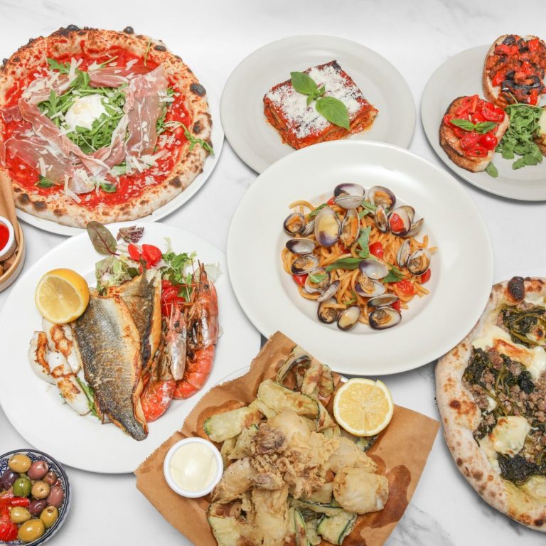 Selection of Southern Italian dishes at Amore & Limoncello, featuring Neapolitan pizza, fresh handmade pasta