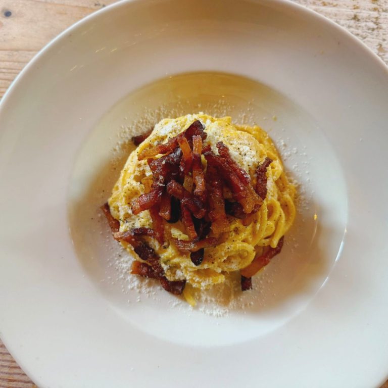 Traditional Carbonara pasta with pecorino Romano, guanciale, and black pepper served at Amore & Limoncello Italian restaurant in Fulham